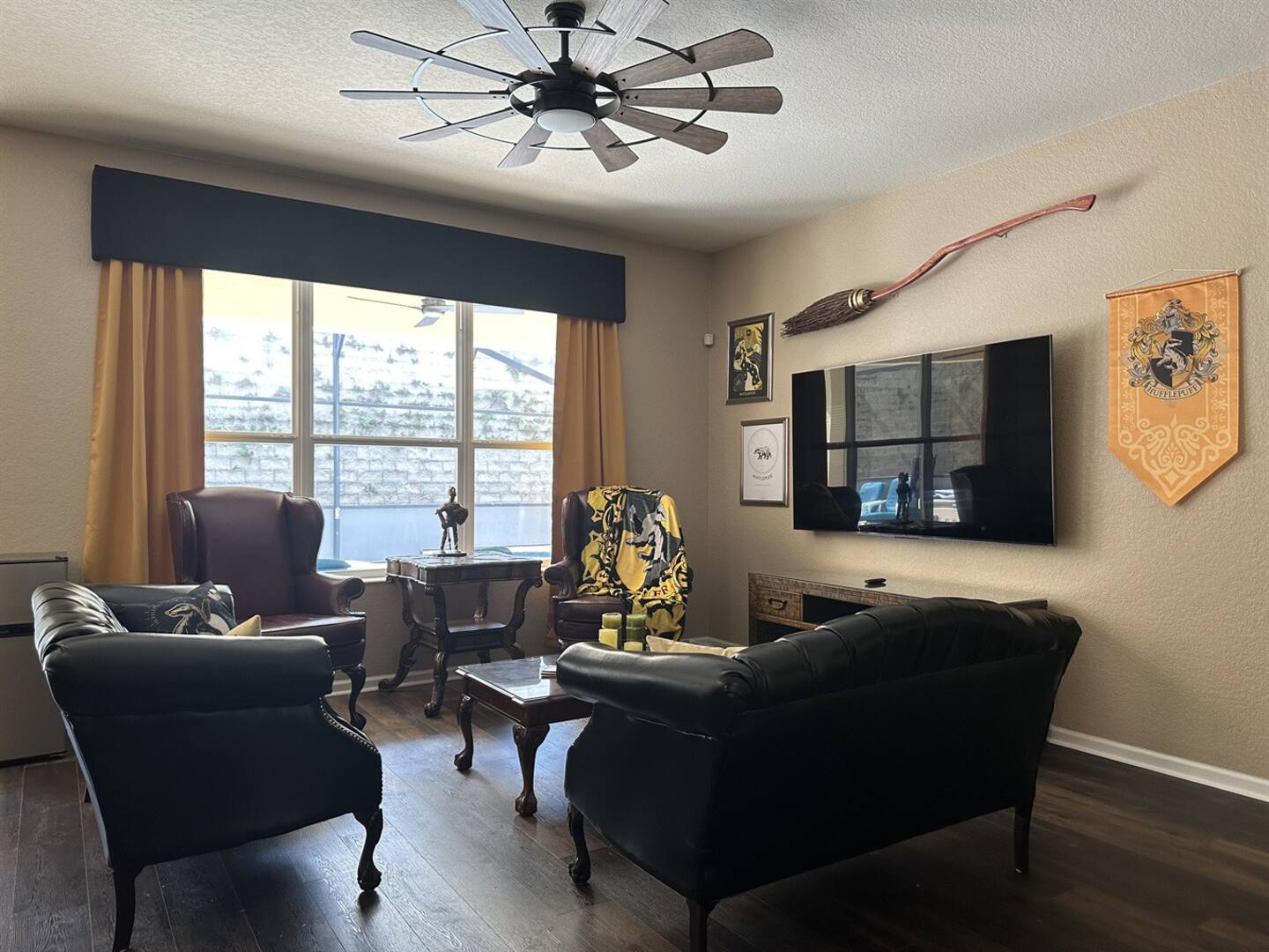 The main living area is decorated in black and gold for Hufflepuff.