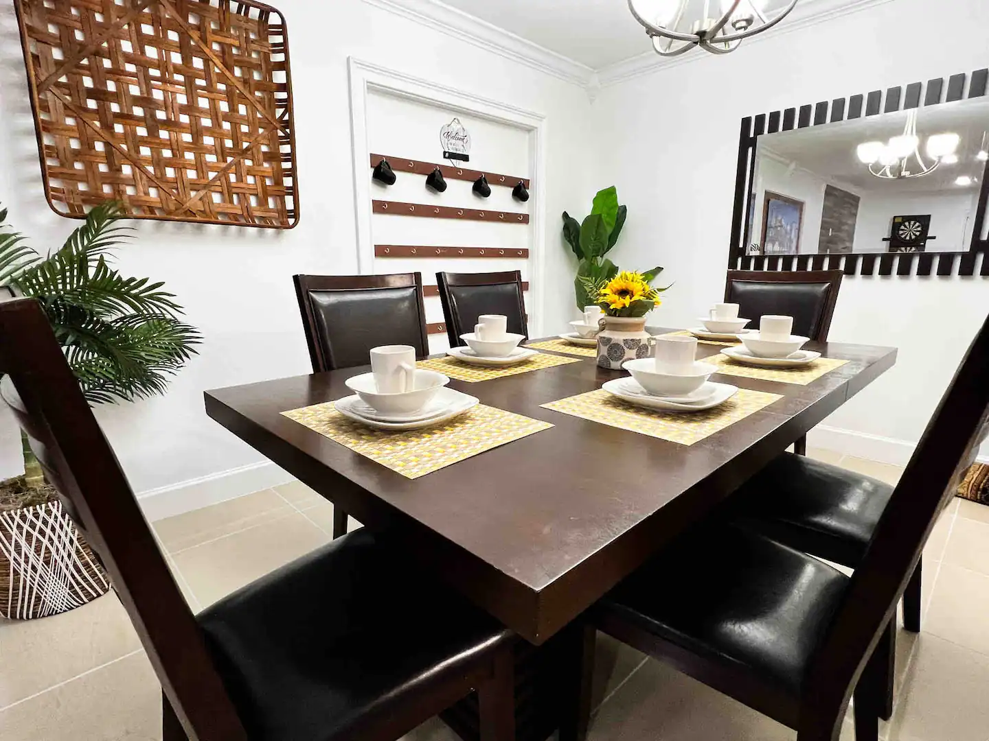 A large dining table will accommodate six guests.