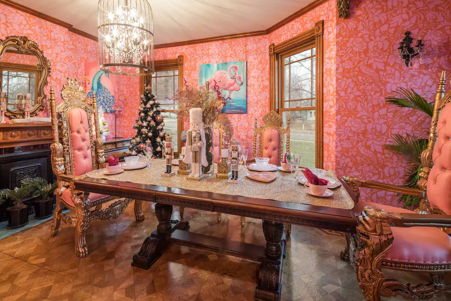 A large beautiful table surrounded by giant golden thrones.
