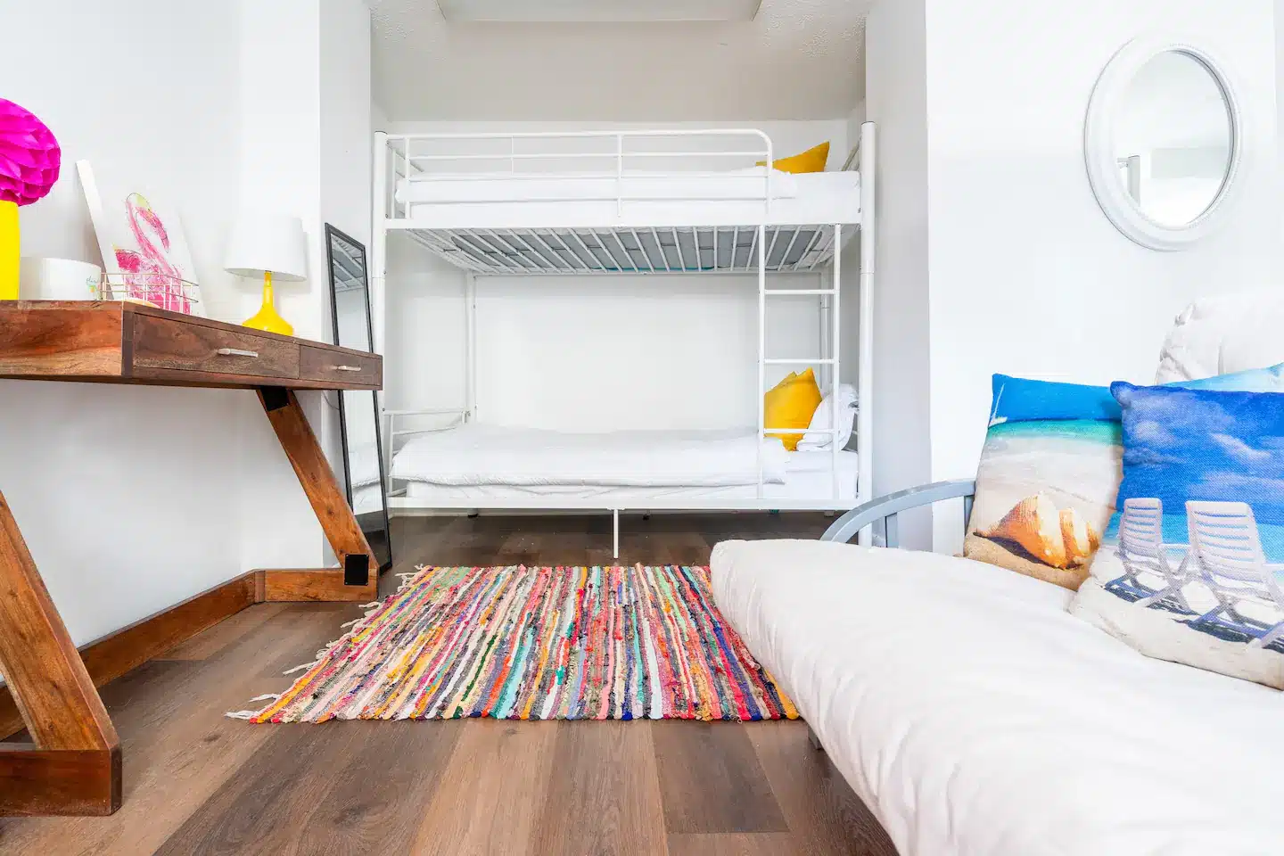 Downstairs "Bedroom Three" with two bunk beds and futon