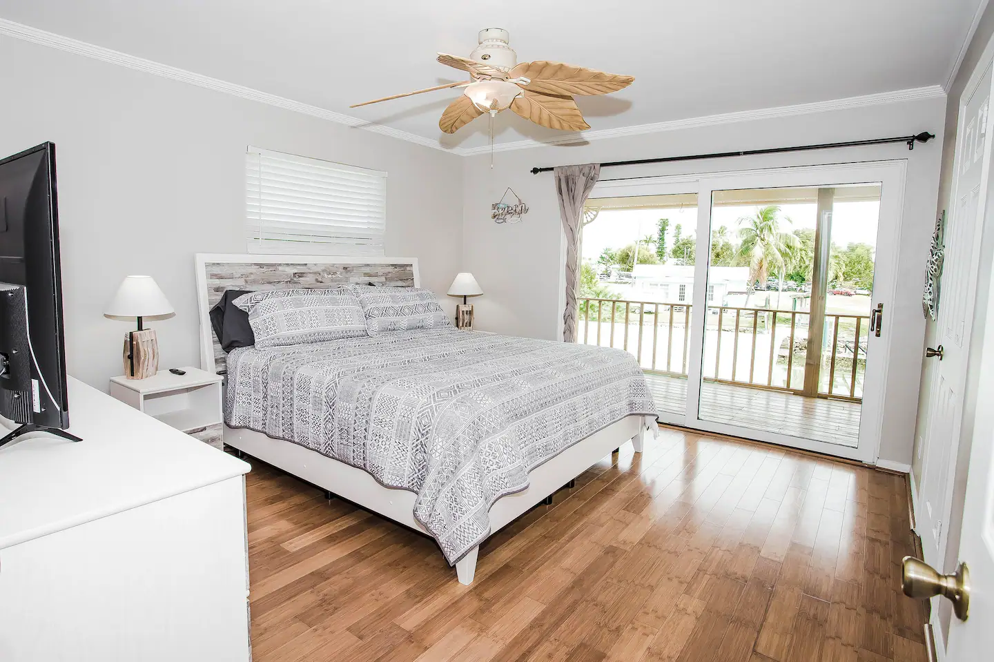 Master bedroom. King sized bed, sliding doors to the patio overlooking the water!