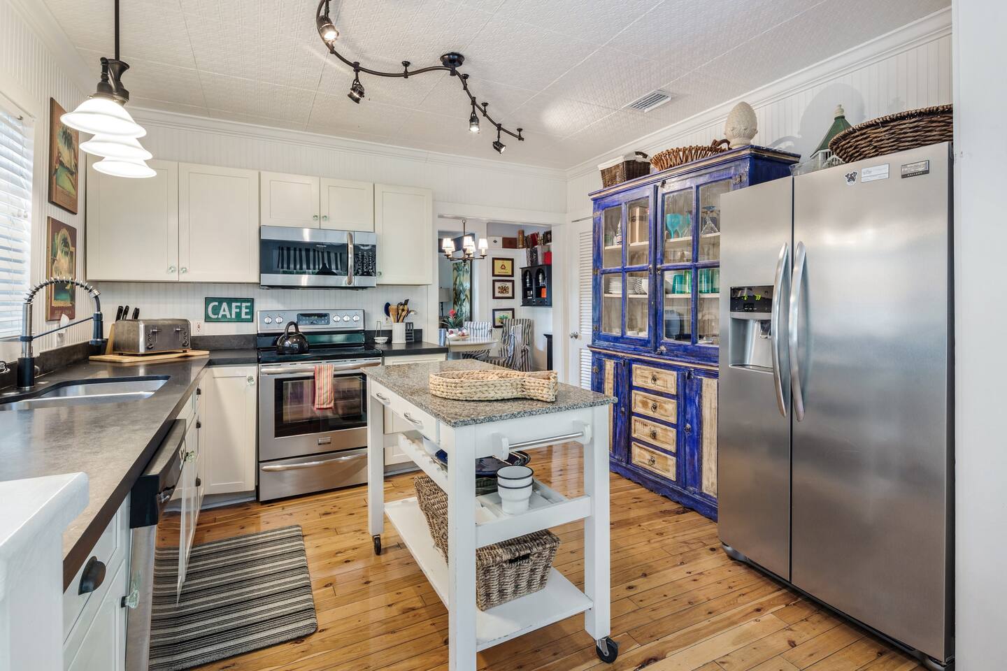 Cottage style kitchen with black granite counters