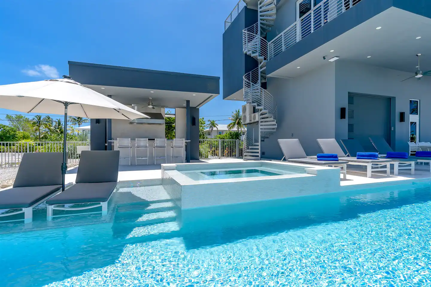 Modern kitchen and living space looks directly over the water
Heated pool and hot tub- perfect for day or night relaxing
